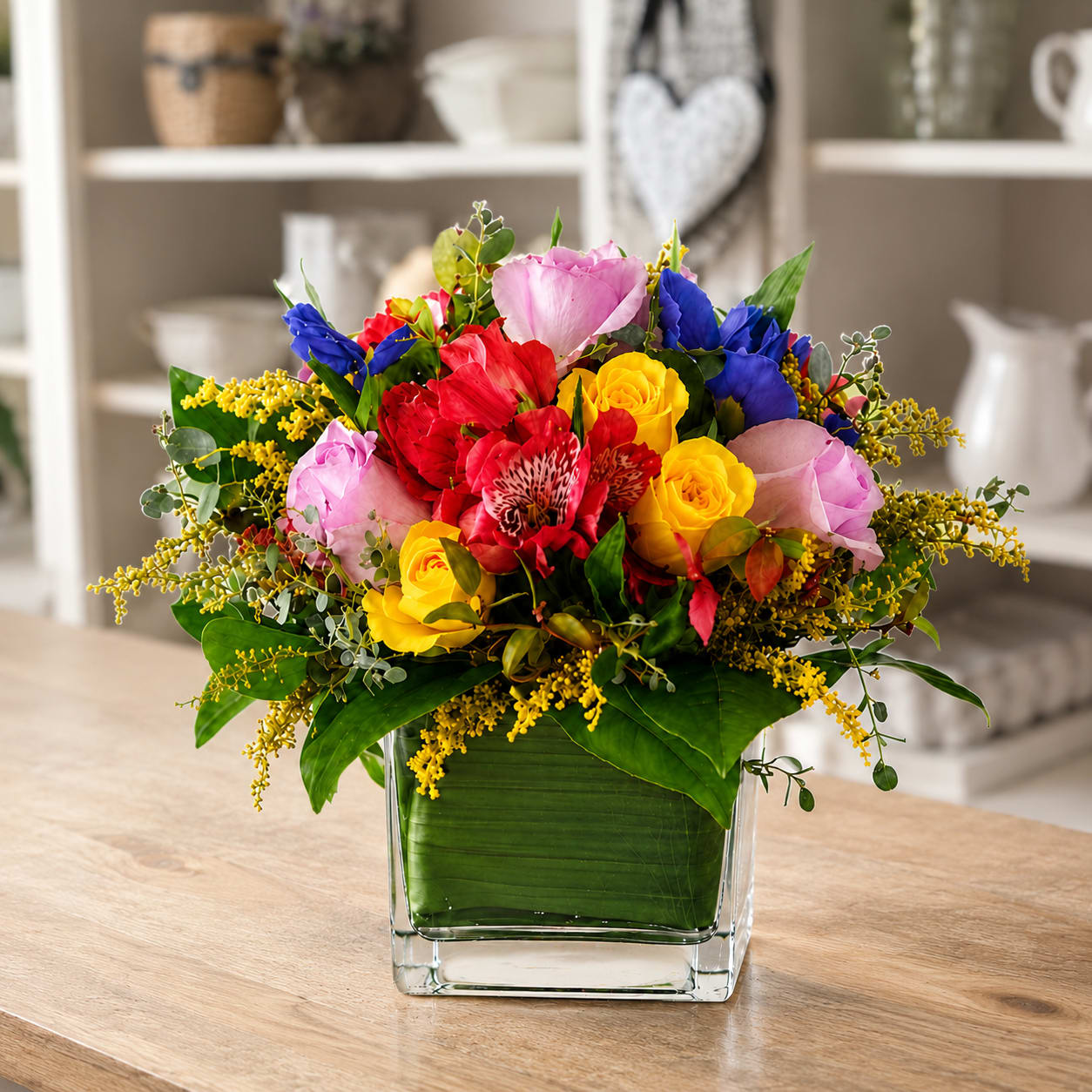 Garden Parade Arrangement – A Celebration of Color - Garden Parade Arrangement – A Celebration of Color  Bring the joy of a blooming garden indoors with the Garden Parade Arrangement by My Blooming Business. This vibrant and cheerful design features a lively mix of bright yellow, cheerful pink, and pastel lavender florals, perfectly accented with lush green foliage. Arranged in a modern 4x4 glass cube, this compact design delivers maximum impact in a minimal footprint.    Perfect for birthdays, celebrations, or just because, the Garden Parade adds instant happiness to any room.    As a top-rated florist in Los Angeles on Google, Yelp, and BloomNation, My Blooming Business proudly offers flower delivery throughout Los Angeles, including the San Fernando Valley and San Gabriel Valley.    