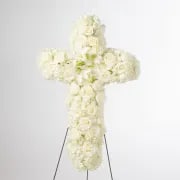 Faith by BloomNation™  - An all white tribute, this white cross funeral spray is pure and tranquil. Featuring a variety of white flowers, this elegant easel compliments the beauty of life. 