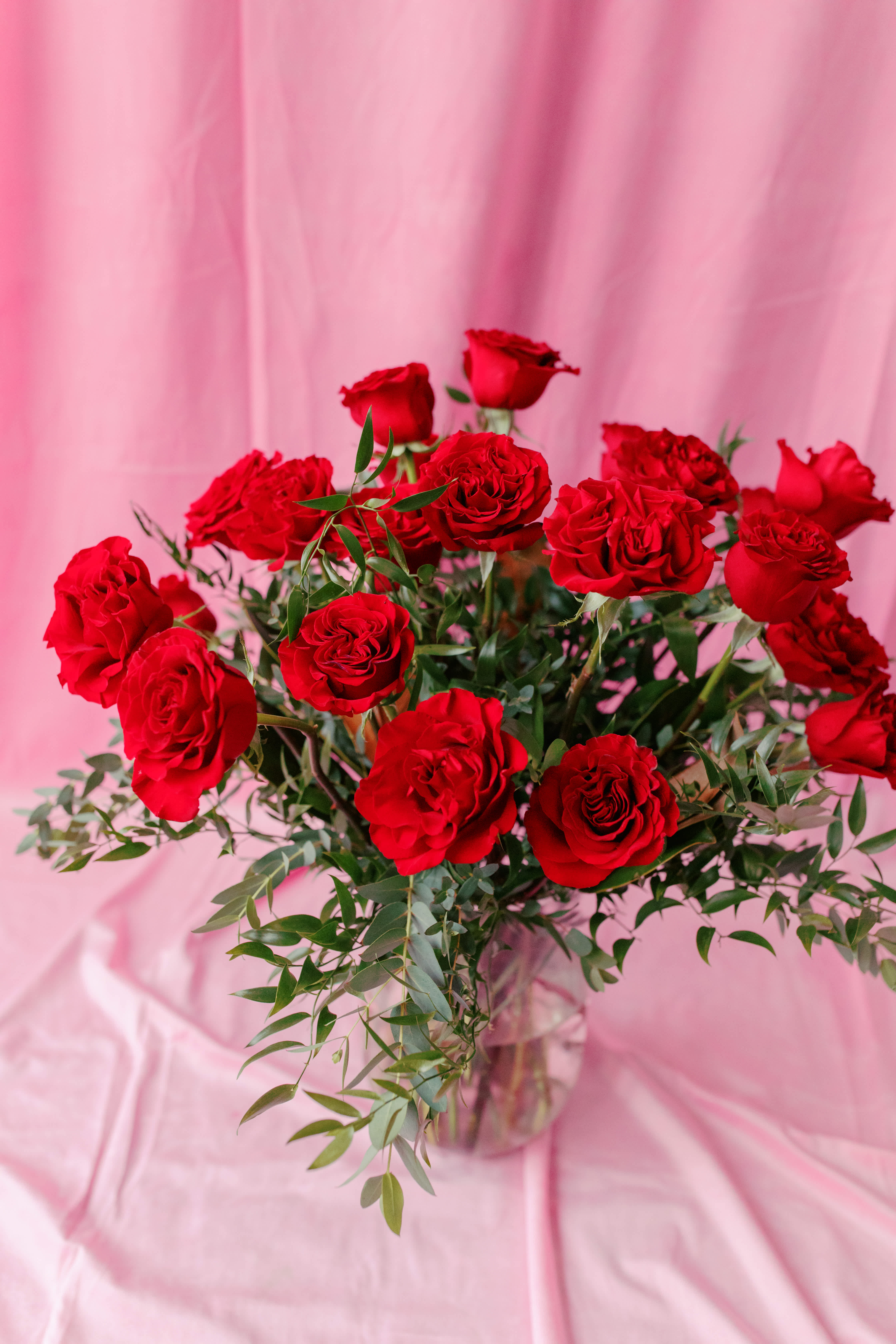 Bouquet of red roses in a clear glass vase