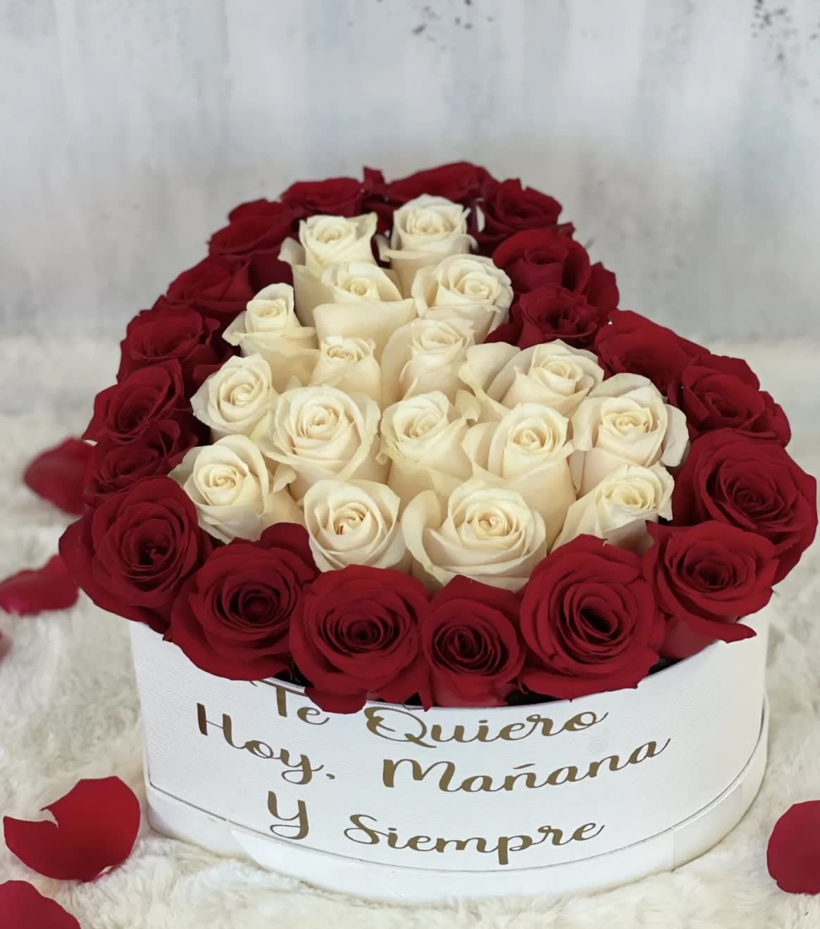 Enduring Passion - This flower box is will have red and white roses incorporated into a white box, with four options for box customization. PLEASE INCLUDE NUMBER OF THE LOVE QUOTE IN SPECIAL INSTRUCTION! Standard holds 30 roses and Deluxe holds 40 roses. 1. "you will forever be my always" 2. "Je t'aime" ( I love you in French) 3. "Te quiero hoy, manana y siempre" 4. "I will always love you"  Esta caja de flores tendrá rosas rojas y blancas incorporadas en una caja blanca, con cuatro opciones para la personalización de la caja. ¡POR FAVOR INCLUYA EL NÚMERO DE LA CITA DE AMOR EN LAS INSTRUCCIONES ESPECIALES! 1. "you will forever be my always" 2. "Je t'aime" ( I love you in French) 3. "Te quiero hoy, manana y siempre" 4. " I will always love you"