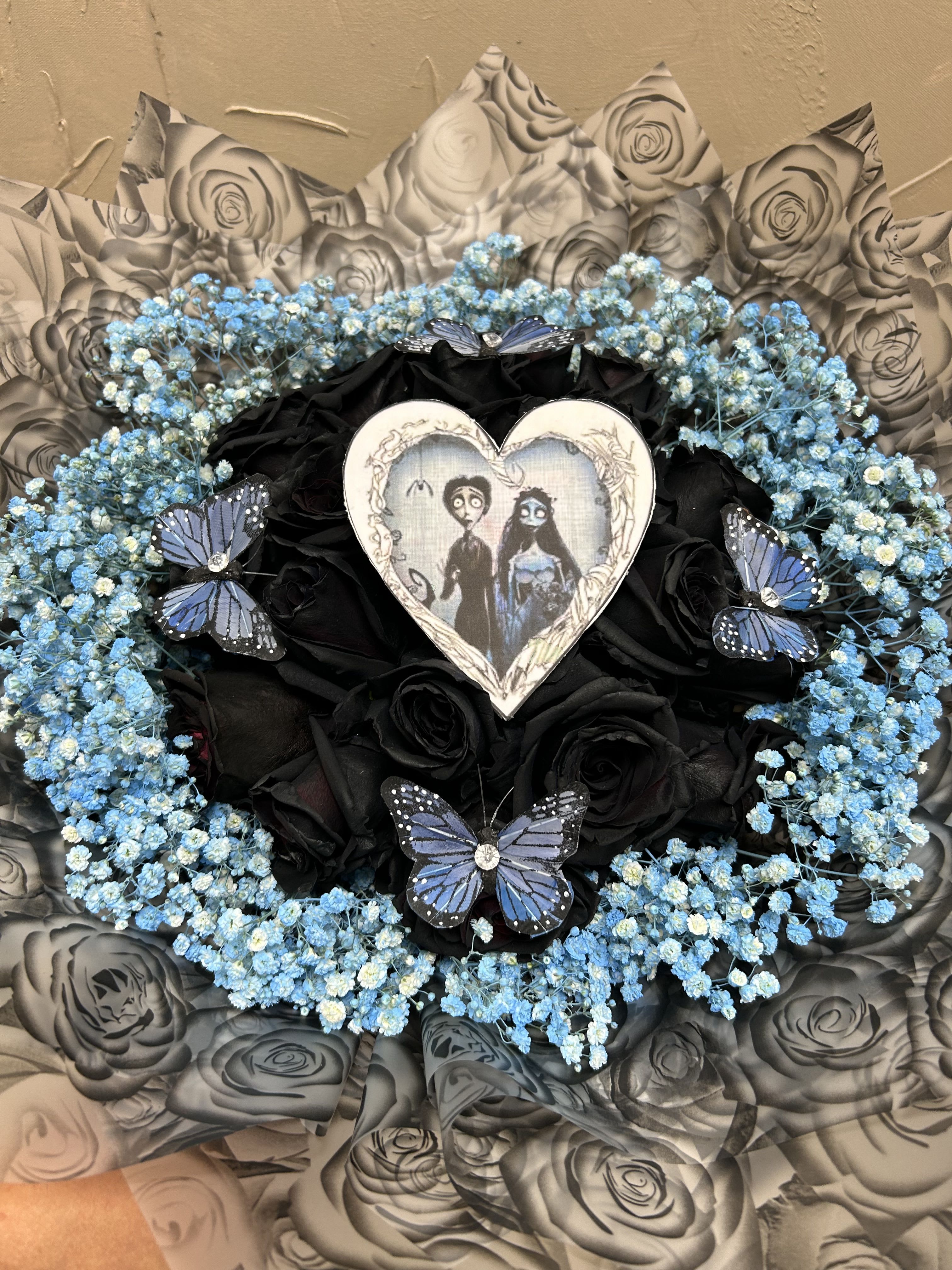 Corpse Bride Spooky Buchón  - 24 black roses In this modern buchón bouquet. 