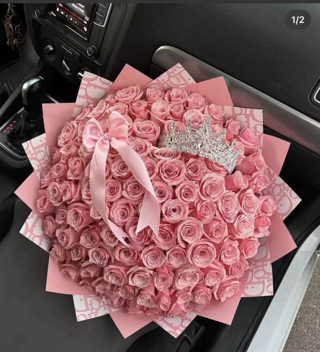 Large bouquet of pink roses with a satin bow and tiara