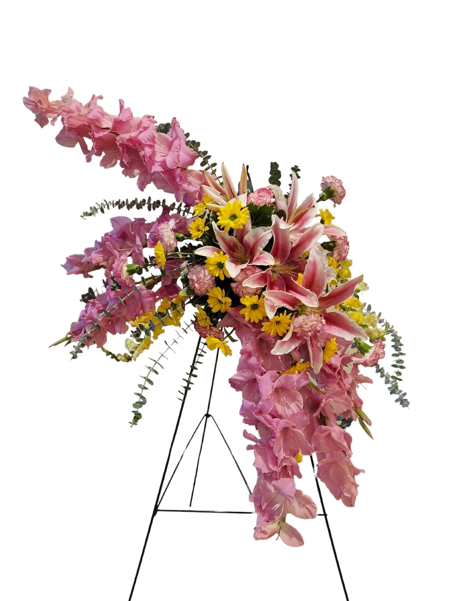 Pink and yellow floral standing spray on a black easel