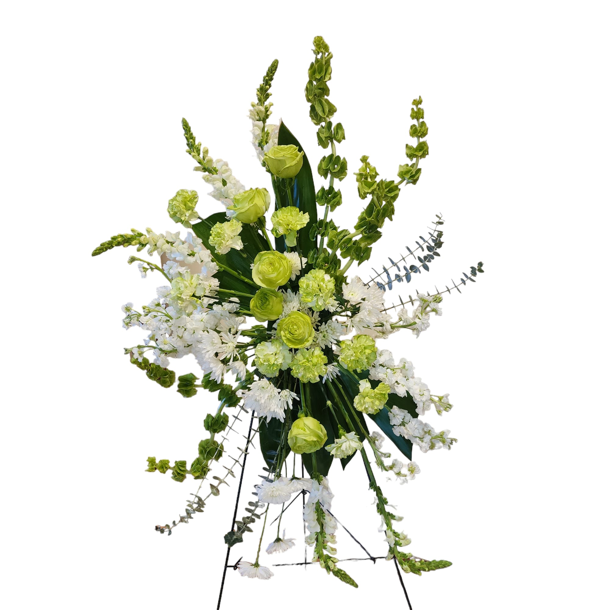 Tall green and white floral standing spray on an easel