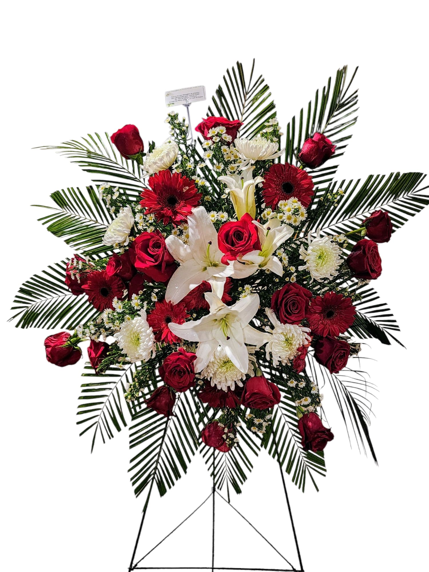 Standing floral spray with red roses, white lilies, and gerbera daisies