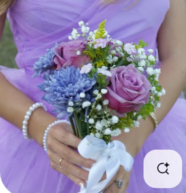 Bridal bouquet of lavender roses and blue flowers with white ribbon