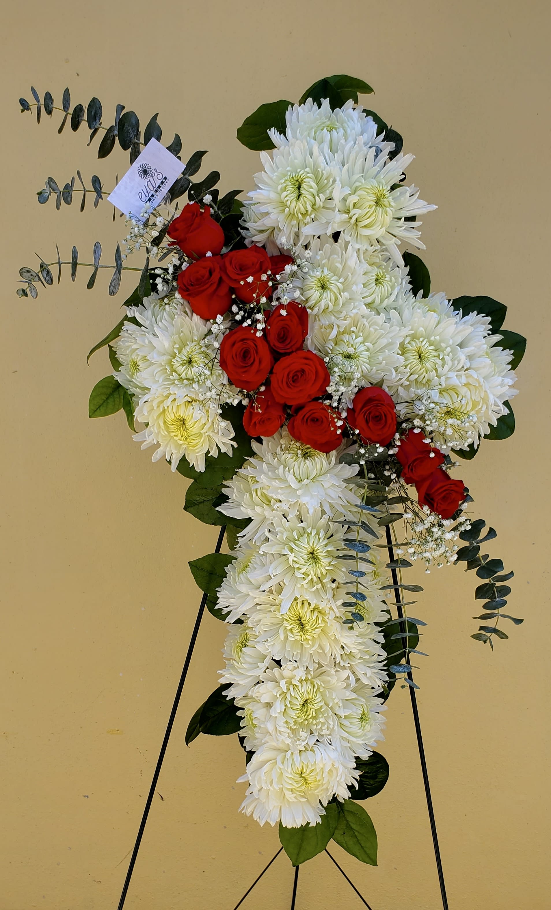 Red &amp; White Standing Cross - Hard Goods: 30'' Cross with 28 white football mums, 12 red roses, 12 salal, 3 eucalyptus spirals, and 2 gypsophila.  (Picture depicts a deluxe product; standard (24'' cross) &amp; premium (36'' cross) size available upon request)