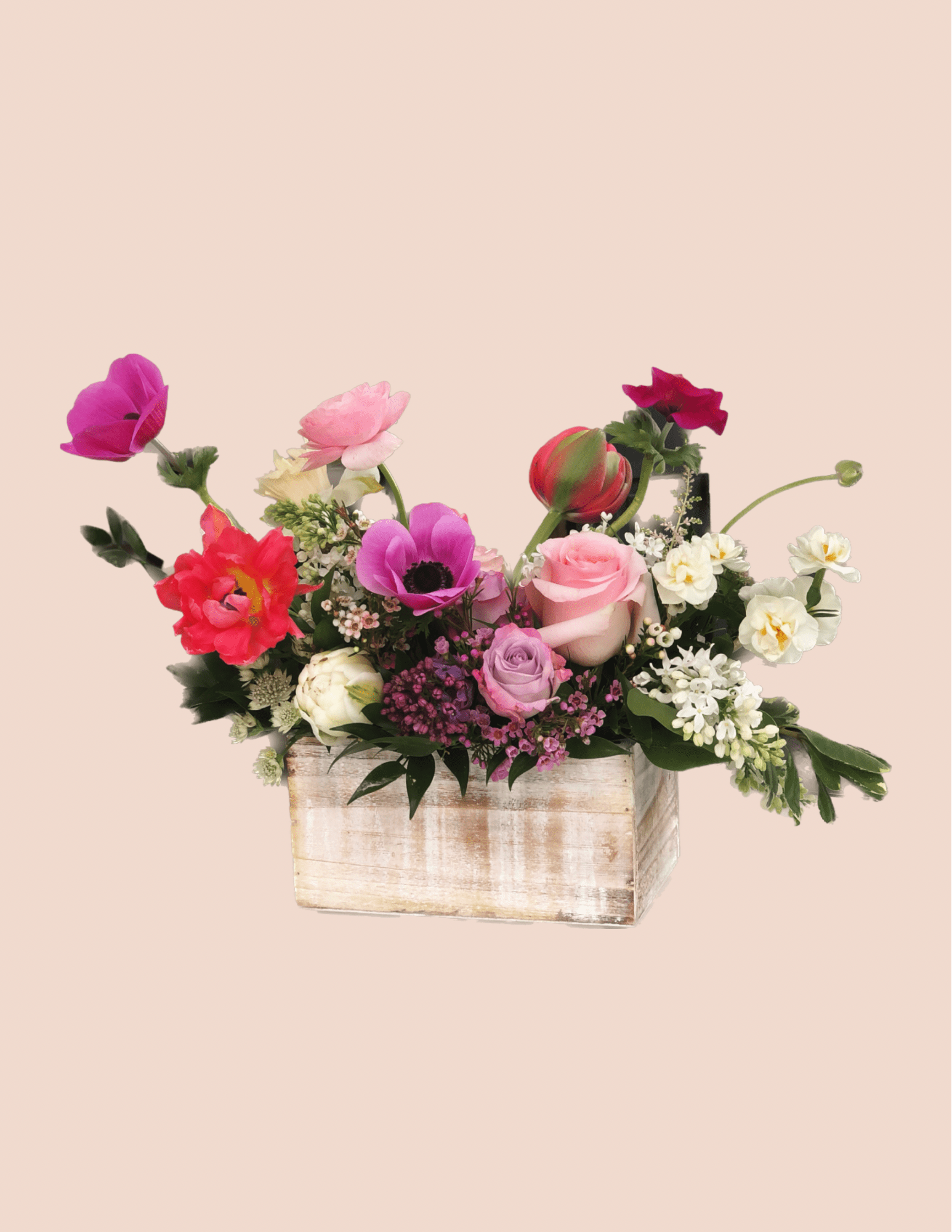 Mixed bouquet in a rustic wooden box with pink, red, white, and purple blooms