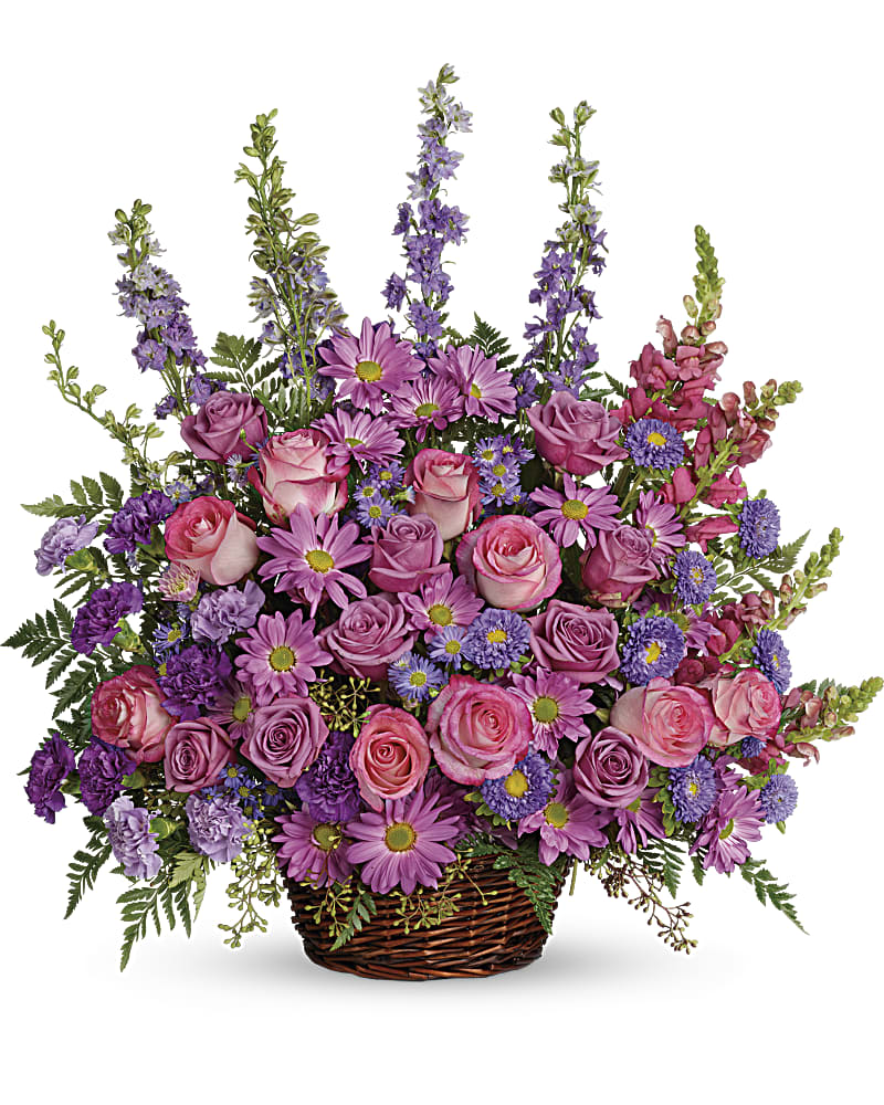 Basket arrangement of pink and purple flowers with tall spikes