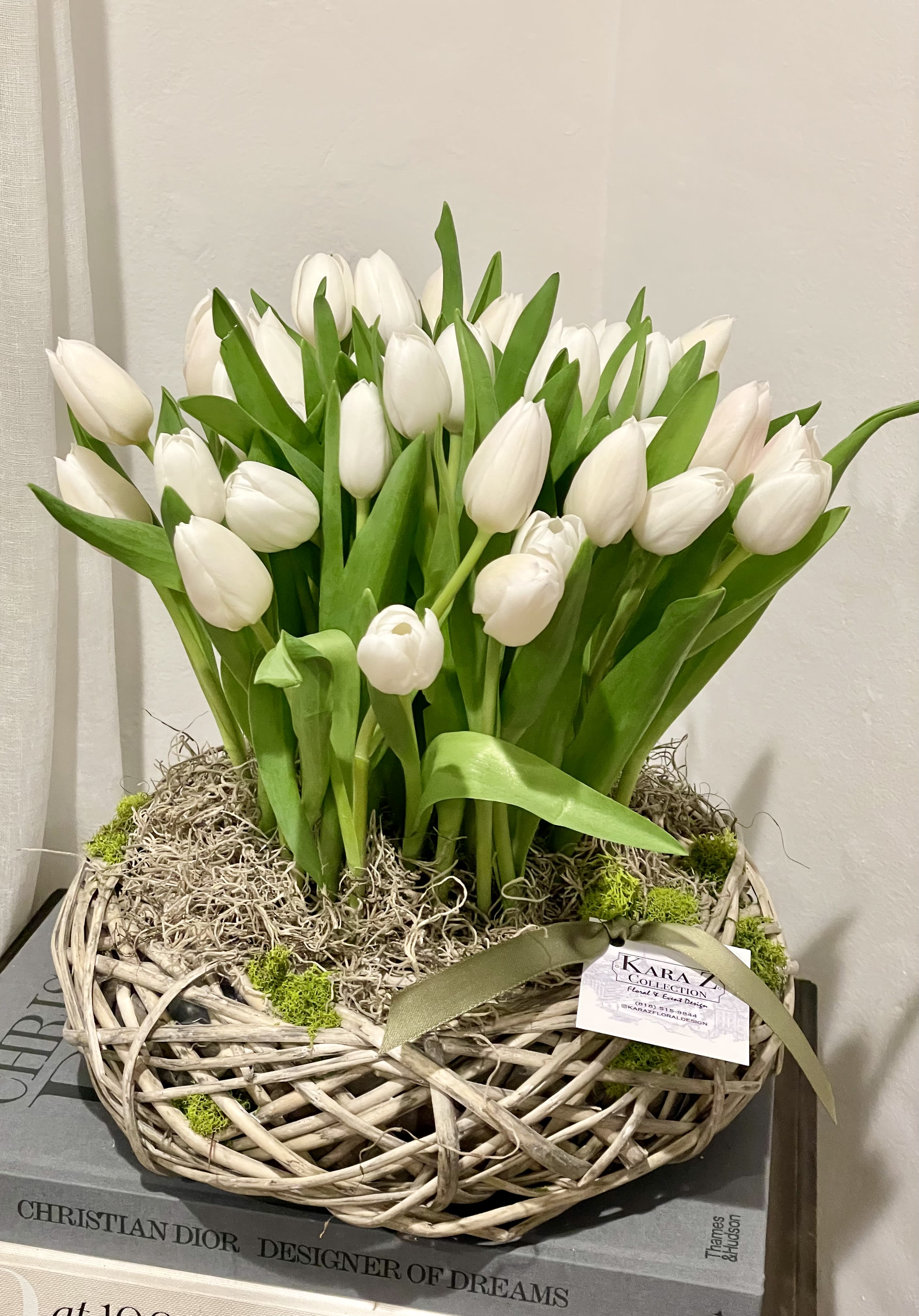Tulips in Bloom - A luxe gathering of tulips carefully arranged in a modern take on the Easter basket. 