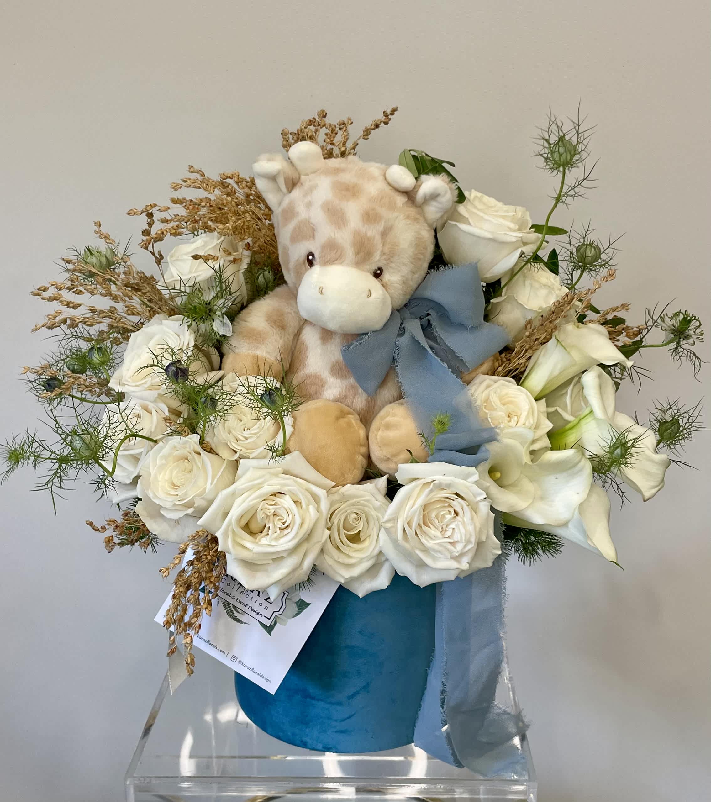 Welcome Little One - The perfect welcome baby florals, includes Playa Blanca roses various other complementary florals with a teddy giraffe or other teddy options.