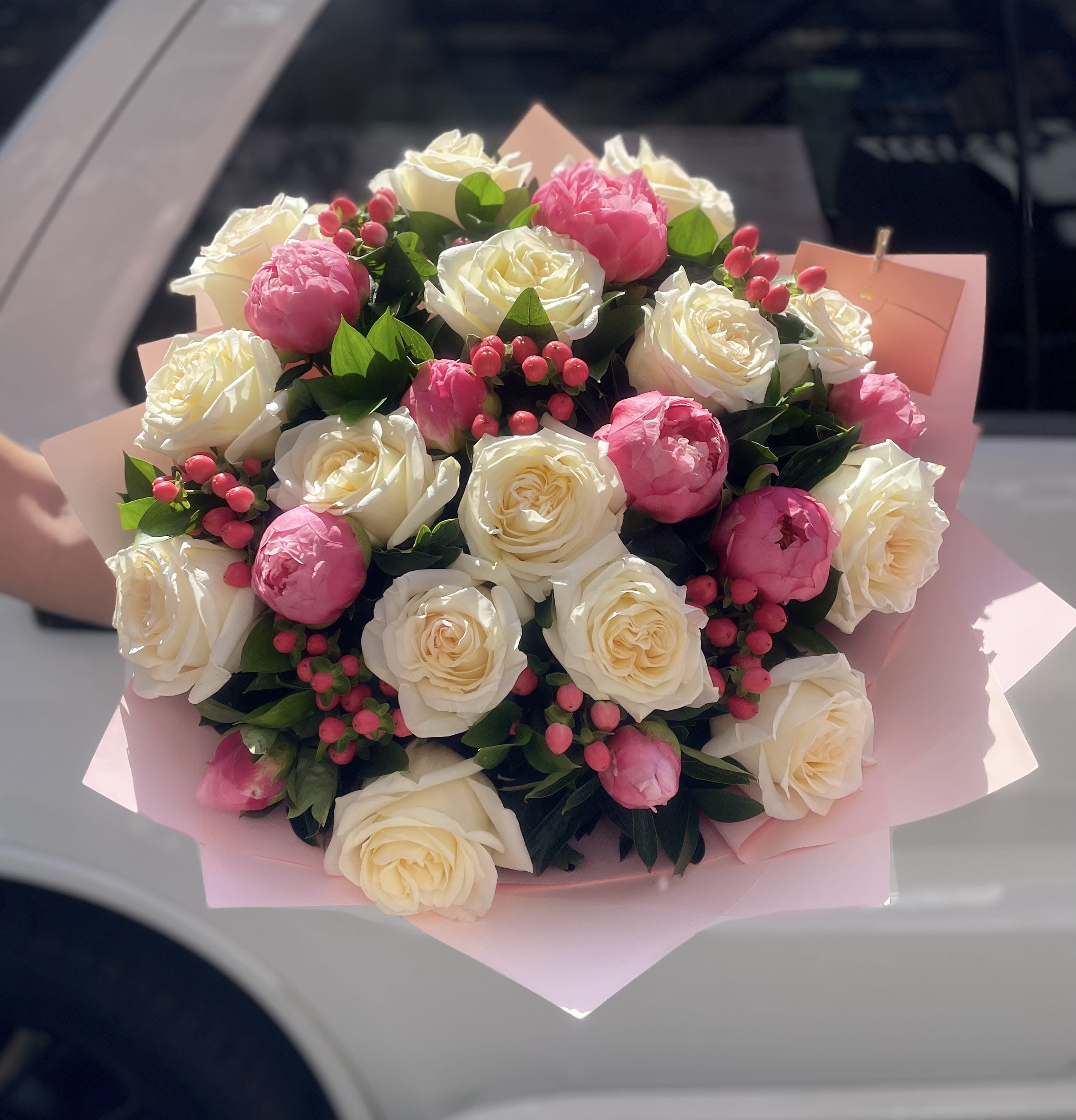 Bouquet with coral peonies.               The photo shows a deluxe size. - On the first photo is a deluxe size.