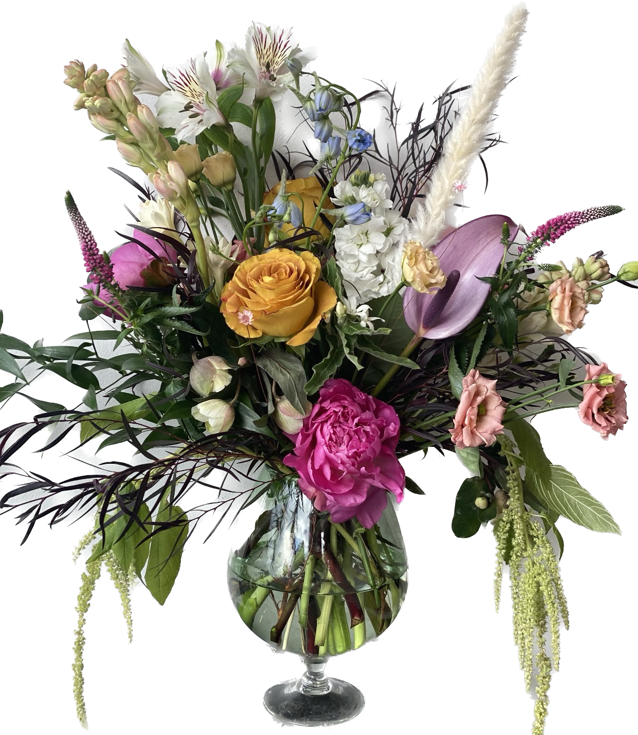 Valentina  - Variety of beautiful blooms included are, but not limited to, Anthurium, garden roses, veronica, lisianthus gravelia, tuberose, peonies, stock, helebores, amaranthus  Vase included