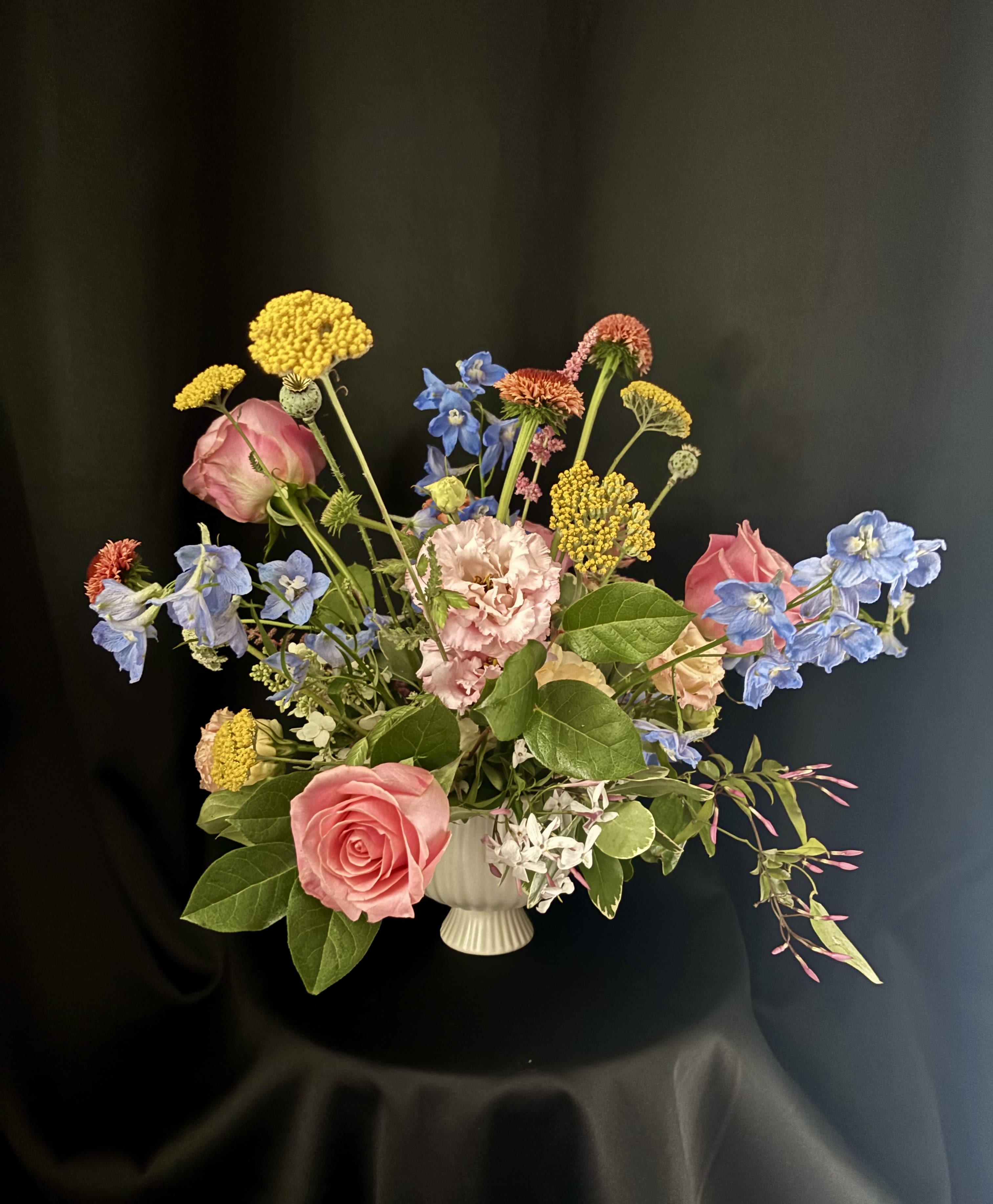 Elegant Seasonal Compote - Smaller in scale, but with premium florals, this elevated arrangement comes in a small, ribbed compote perfect for any special occasion.  Local, farm fresh flowers will also be incorporated for seasonal flair. 