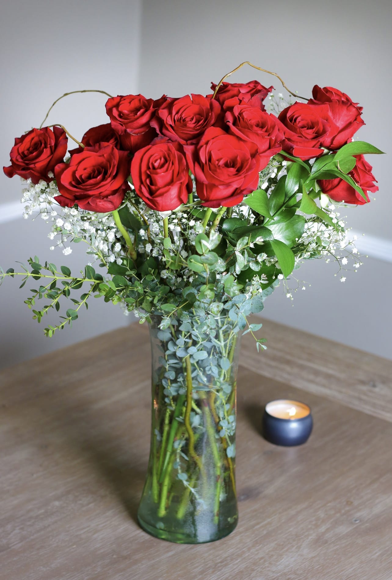 Dozen Red Roses  - Experience the Timeless Elegance of Red Roses - Stunning Floral Arrangement with Greenery in Glass Vase. Perfect for Weddings, Anniversaries, and Special Occasions. Shop Now and Elevate Your Space!" #RedRoses #FlowerArrangement #GlassVase #SpecialOccasions #Weddings #Anniversaries