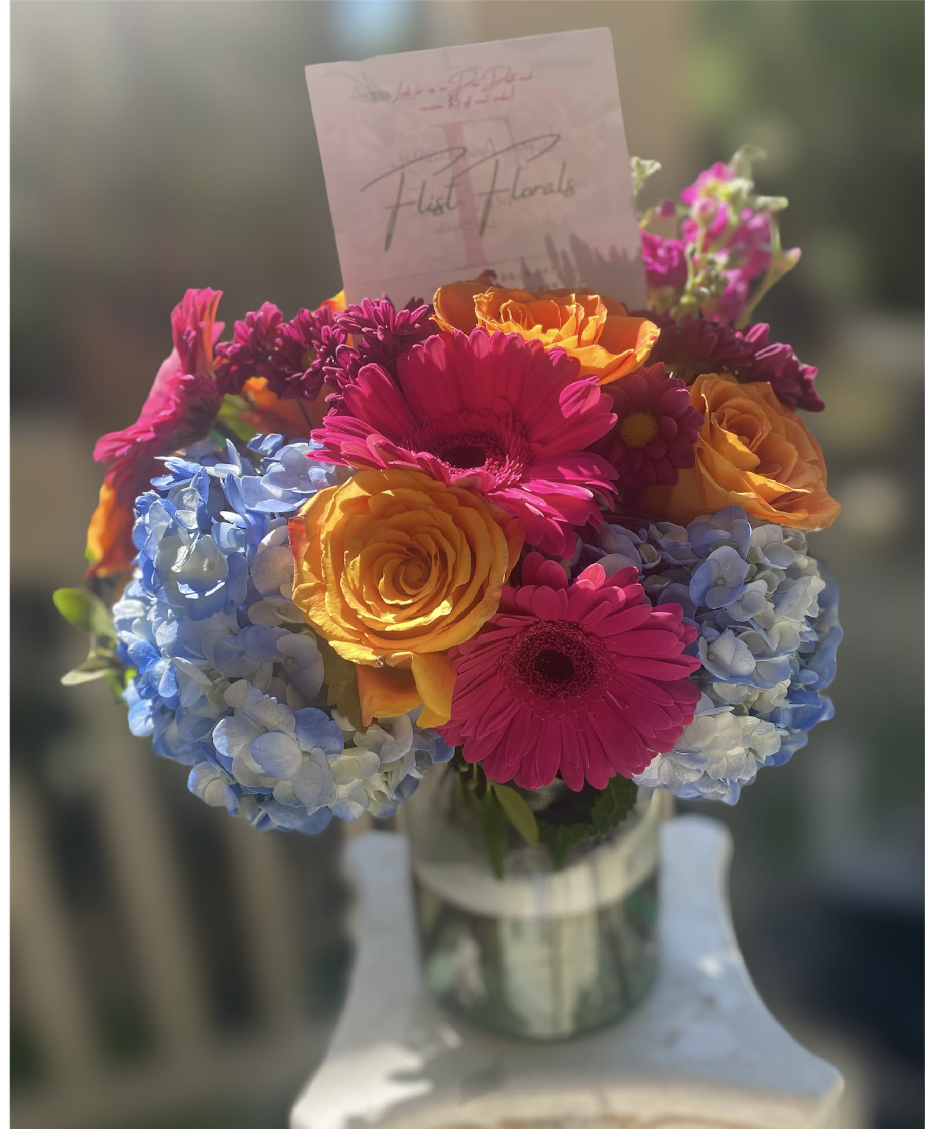 Downtown Canton - With the mixture of hot pink gerb daisies, orange roses and blue hydrengeas, how could one not be happy!  