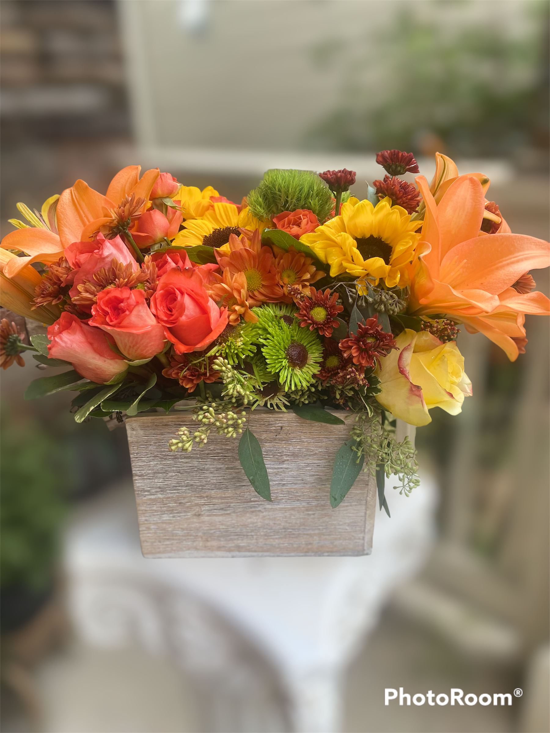 Box of Sunshine - Let your love shine as bright as the sun with our signature Box of Sunshine! Embrace a box full of sunflowers, orange roses and garden daisies and fillers! 