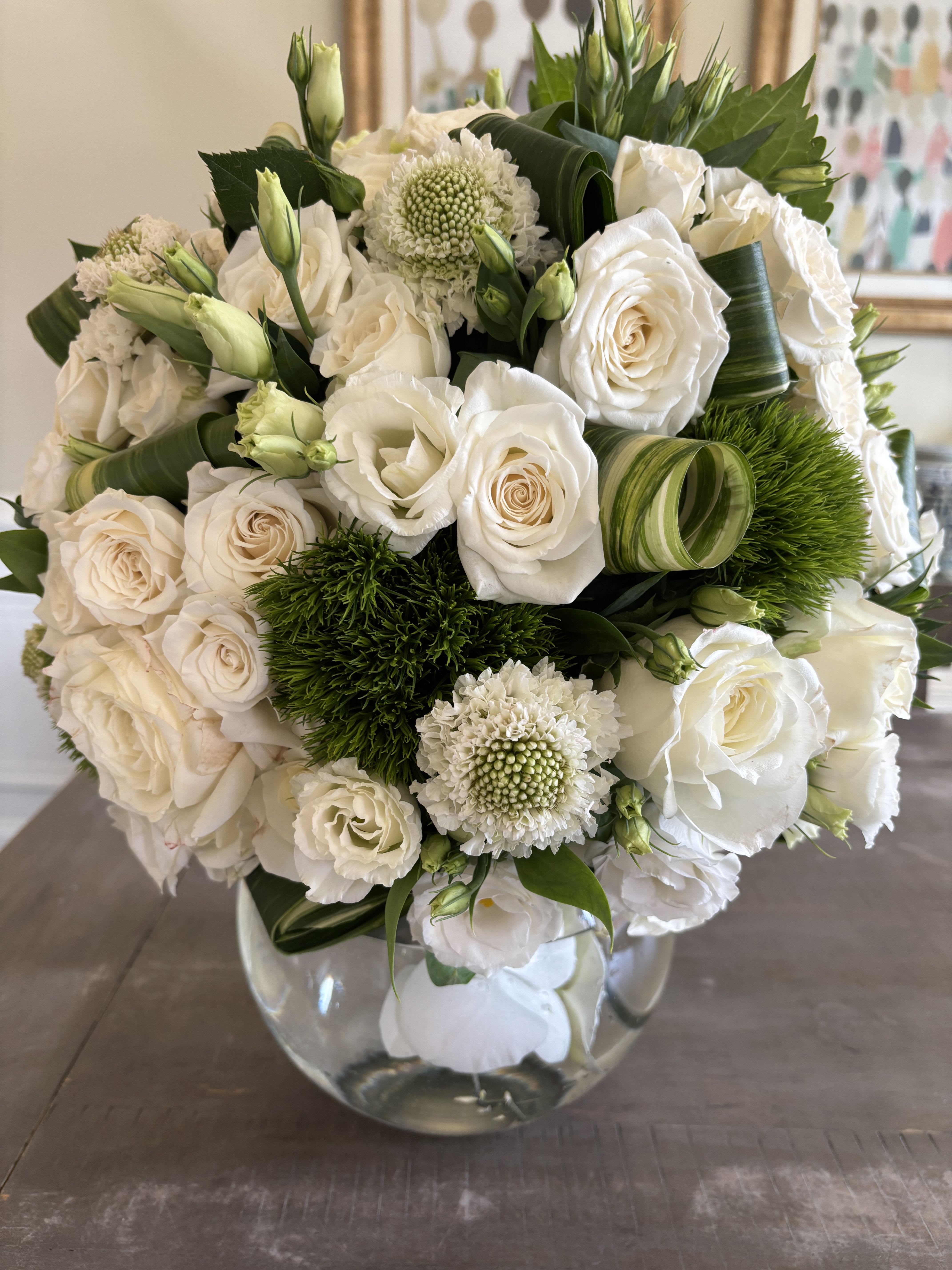 Mint Condition  - A medley of white mondial roses with luxury accent florals and Ti leaves 