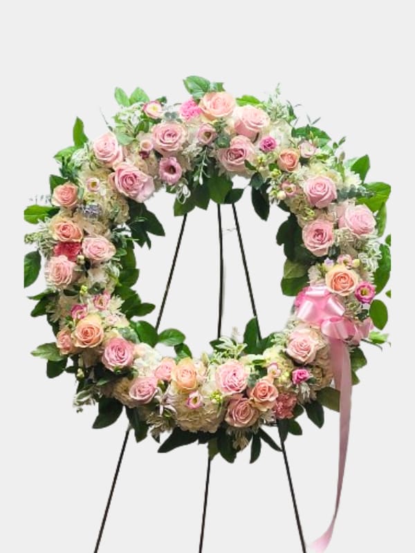 Serene Blessings Standing Wreath - This Standing Wreath is a beautiful reflection of your love and sympathy. Sent directly to the funeral home by family, friends and business associates. Our florists use only the freshest flowers available, so colors and assortment may vary. 