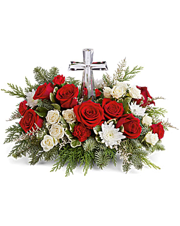 Red and white rose arrangement with a clear cross centerpiece