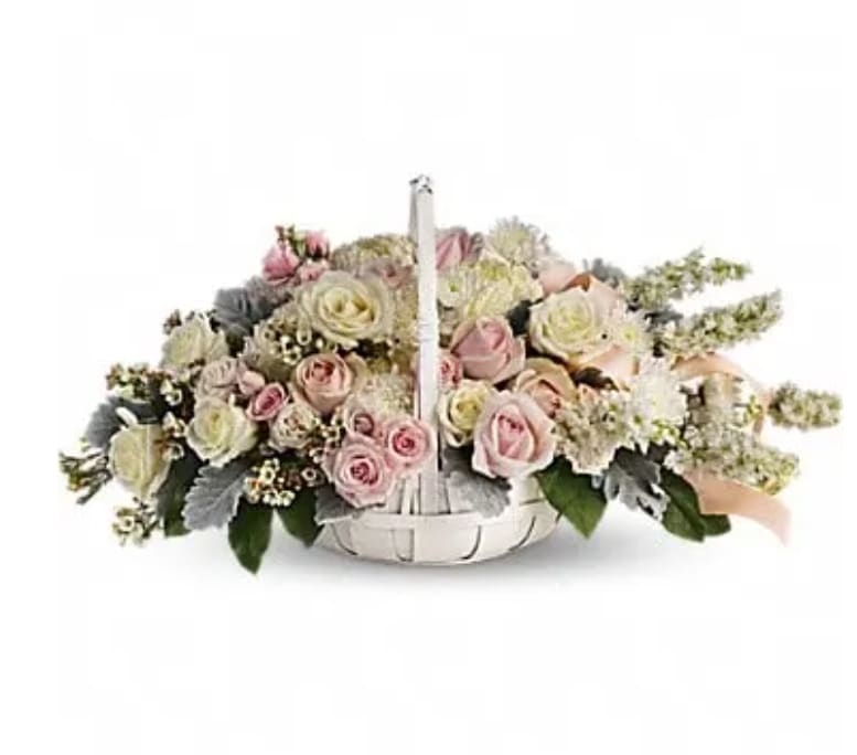 Basket arrangement of pink and white roses with a handle
