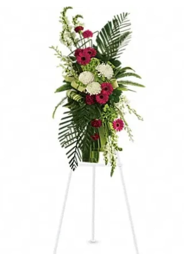 Tall floral spray with pink and white blooms on a stand