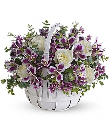 Sweet Moments - Know someone who needs a lift? Brighten their day by sending this lovely bouquet of fresh flowers that has sweetness woven right in. Gorgeous white roses, purple alstroemeria, lavender waxflower and eucalyptus are perfectly arranged in a white basket. Perfectly sweet!
