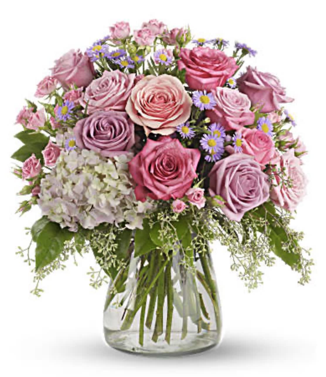 Pink and lavender rose bouquet in a clear glass vase