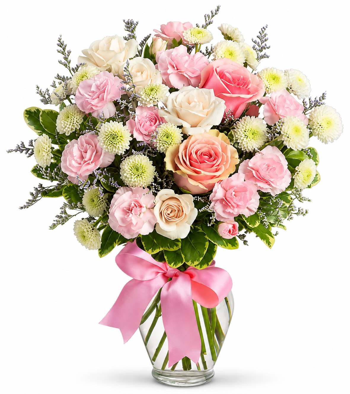 Pink and cream rose bouquet in a glass vase with a pink ribbon