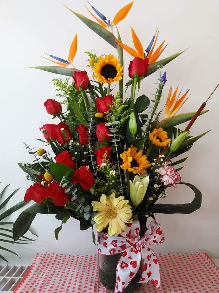 Exquisite Artistic Style Bouquet - A delightful combination of flowers in a stylish glass vase.