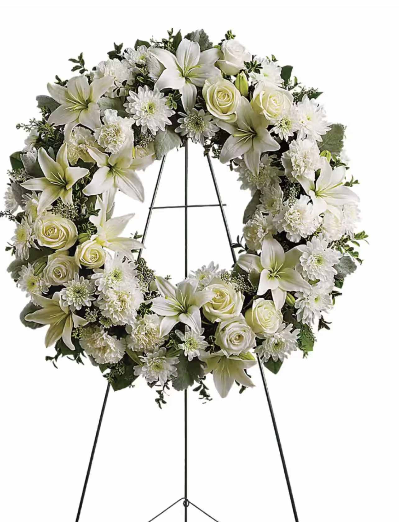 White floral wreath on a black easel stand