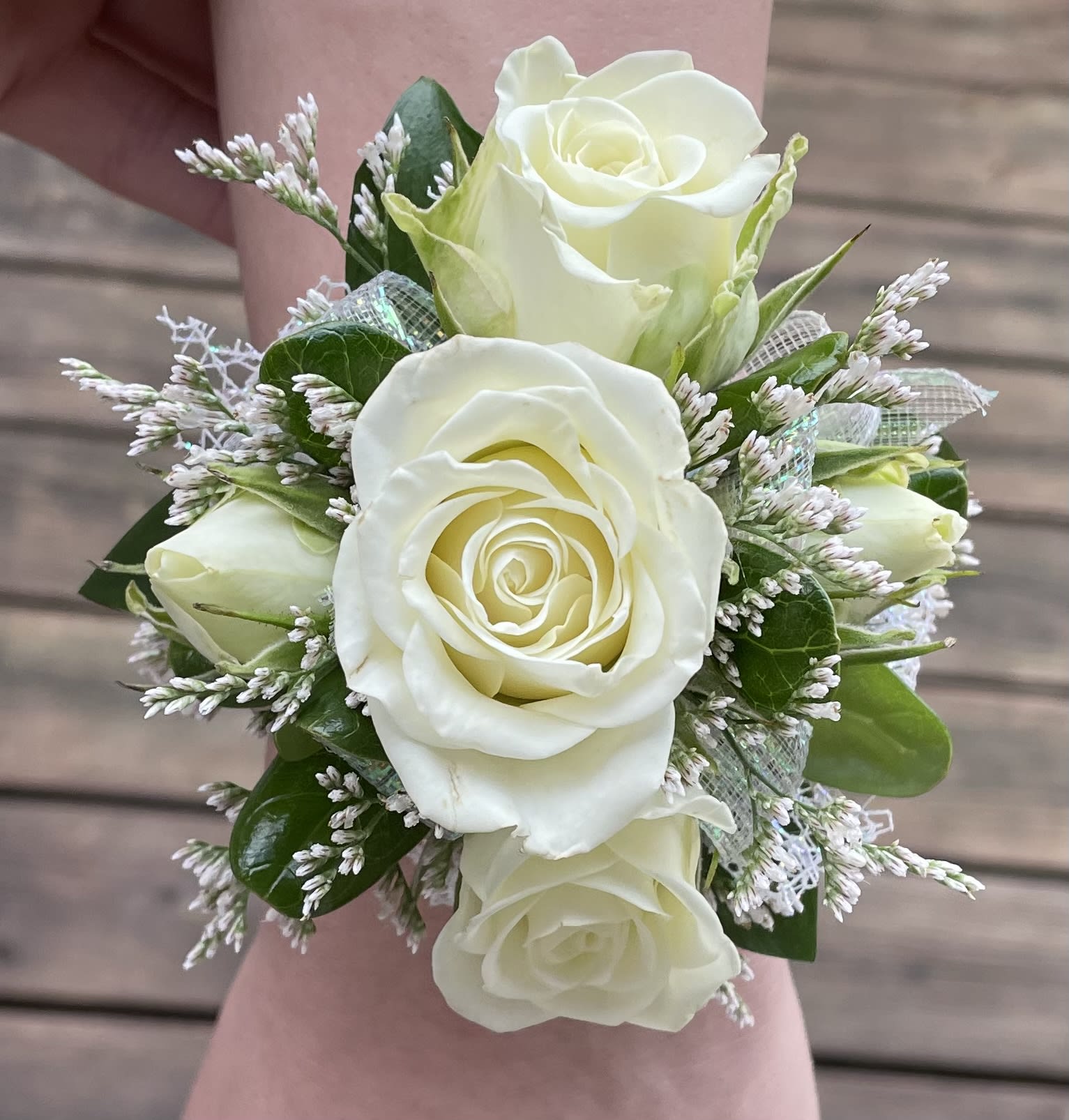 Corsage on Elastic Band  - Wrist corsage on elastic band with miniature roses. Leave color is roses preferred and colors of the dress we are matching in "florist instructions" section at checkout.  