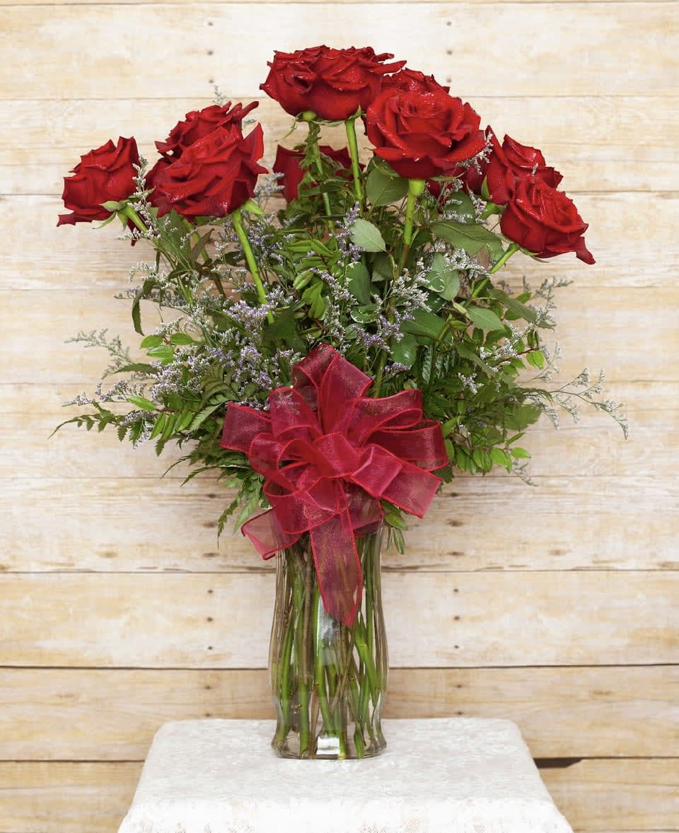 Deluxe Dozen LONG Stem Red Roses  - These dozen red roses are the classic romantic gift! Perfect for the love of your life weather it's a just because, Valentine's Day or an Anniversary. Our premium red rose stems are 60cm.   APPROXIMATE DIMENSIONS: 25" H X 18" W