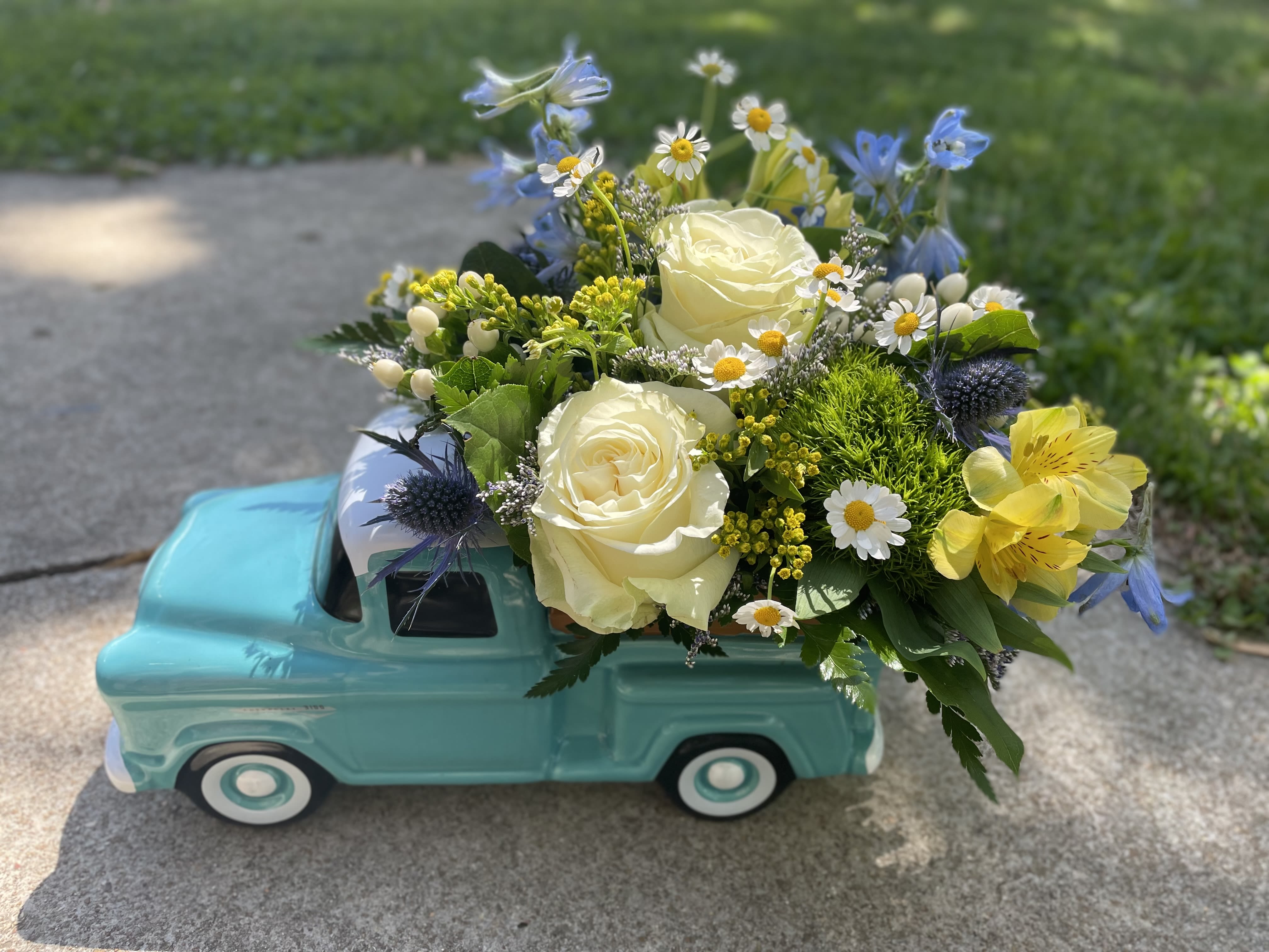Blue Chevy Cruisin  - Our classic Chevy filled with blue, white and yellow blooms. Perfect for any Chevy lover. 