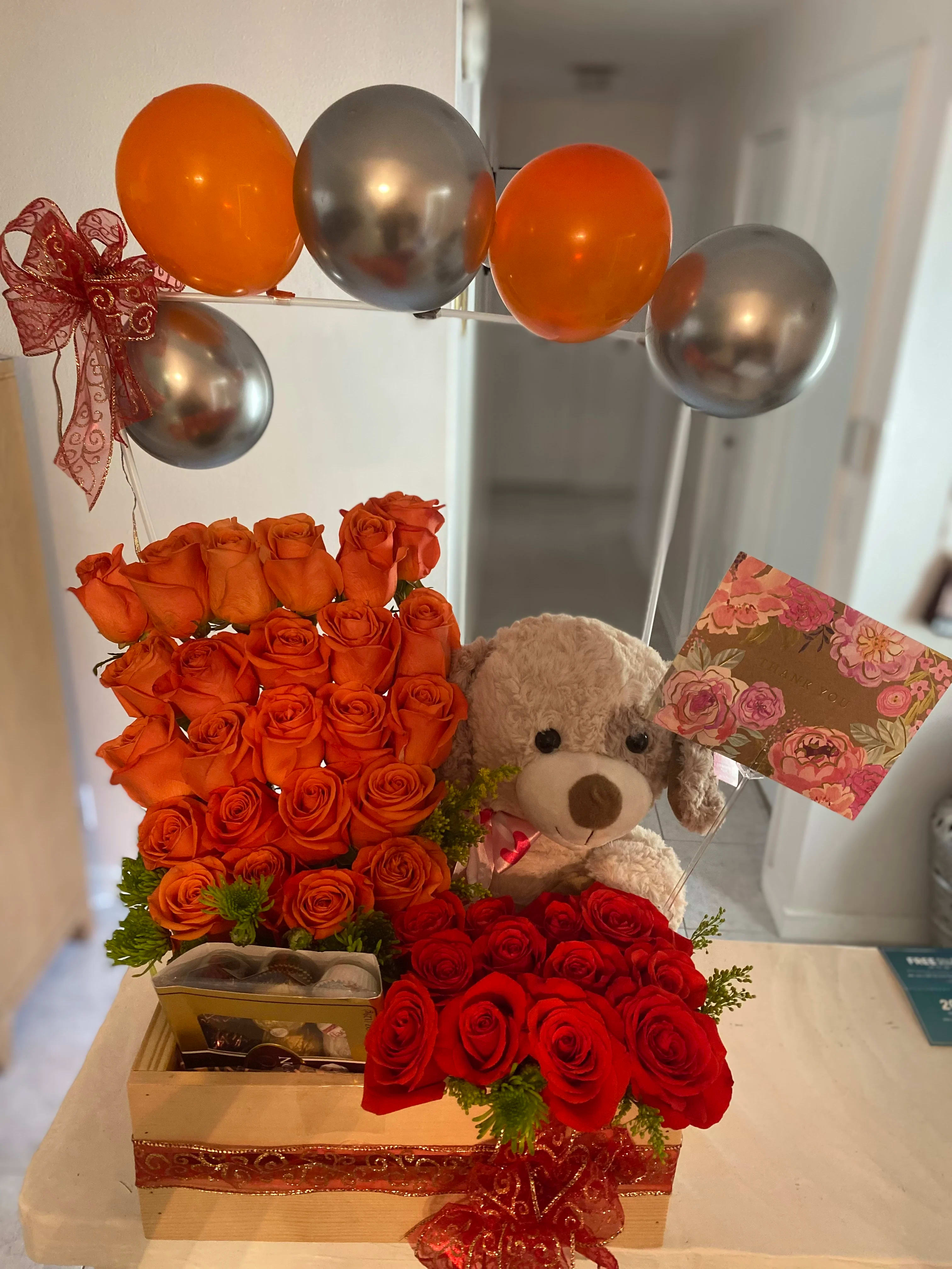 box special - flowers 2 colors 24 orange roses and 12 red roses, teddy bear, and ferreiro chocolate.