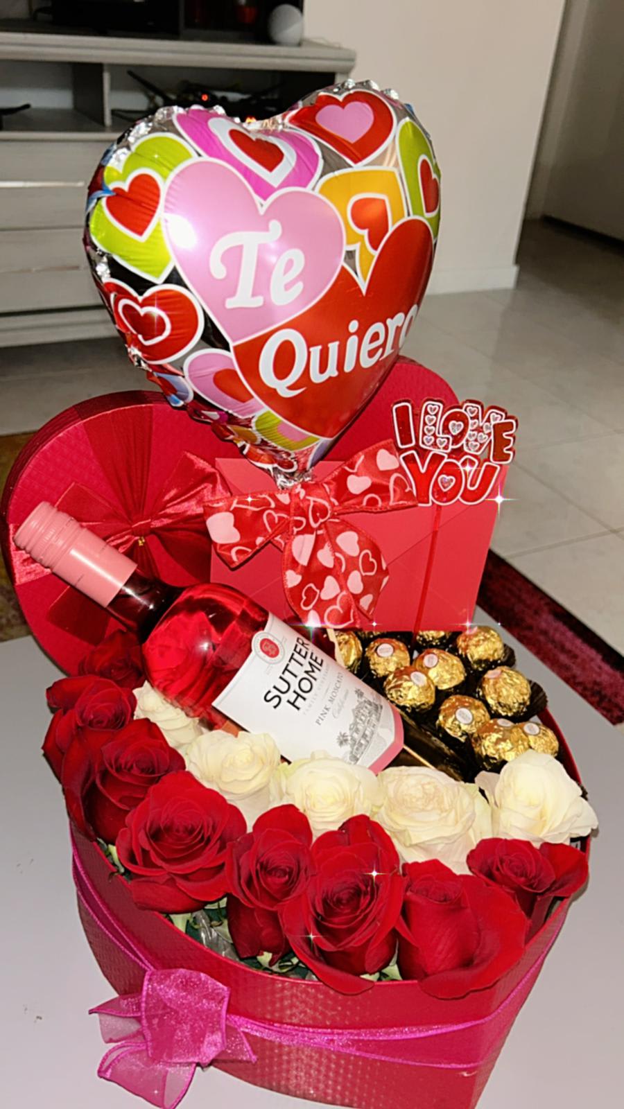 red roses - magnificent, red and white roses , ferrero chocolate, wine. and ballons any ocassion. happy birthday, aniversary, 