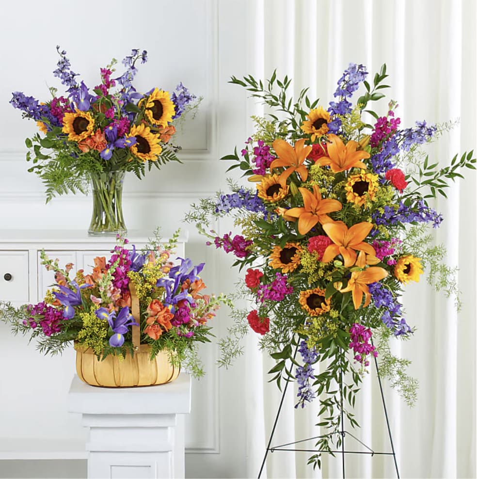 Funeral Combo- Majestic Memento Bundles  ( 2 Day Min Before Service) - MAJESTIC MEMENTO BUNDLES  INCLUDES: - Flower Arrangement - Floral Basket - Funeral Spray  Send a strong show a support with this vividly hued set, which features traditional arrangements meant for celebrating the life of a loved one at a visitation, funeral, church service, cremation, or cemetery service – or as a delivery to the family's home.  Please Note: The bouquet pictured reflects our original design for this product. While we always try to follow the color palette, we may replace stems to deliver the freshest bouquet possible, and we may sometimes need to use a different vase or basket.