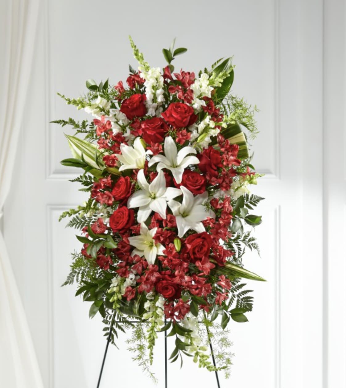 Everlasting Memory Standing Spray - Our Everlasting Memory Standing Spray combines timeless hues with unique blooms to honor the life of the one you have lost. Each lily, rose and snapdragon are elegantly curated by a local florist to share your messages of peace, sympathy and love. It arrives directly from an artisan to your service, making it a truly special gesture.
