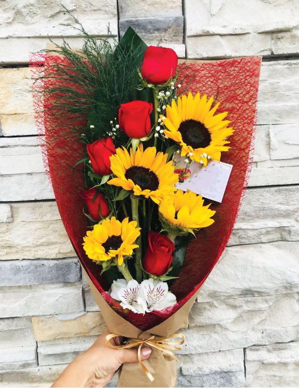 5 Red Roses and 4 Sunflowers  - 5 Red Roses and 4 Sunflowers, an Alstroemeria with accents of baby breath. *** PAPER DESIGN WILL VARY DEPENDING OF AVAILABILITY***