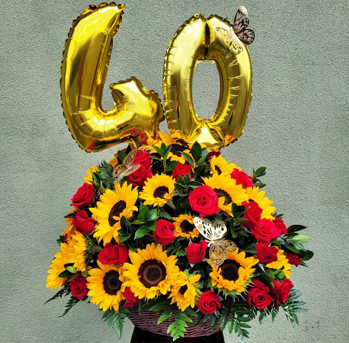 Luxury Celebration Of Sunflowers and Roses - Basket of 24 Sunflowers and 24 Red Roses with Greeneries. *** BALLOONS INCLUDED: ONLY SILVER AND GOLD AVAILABLE, CHOOSE THE NUMBERS*** Bouquet will be delivered approximately as pictured.