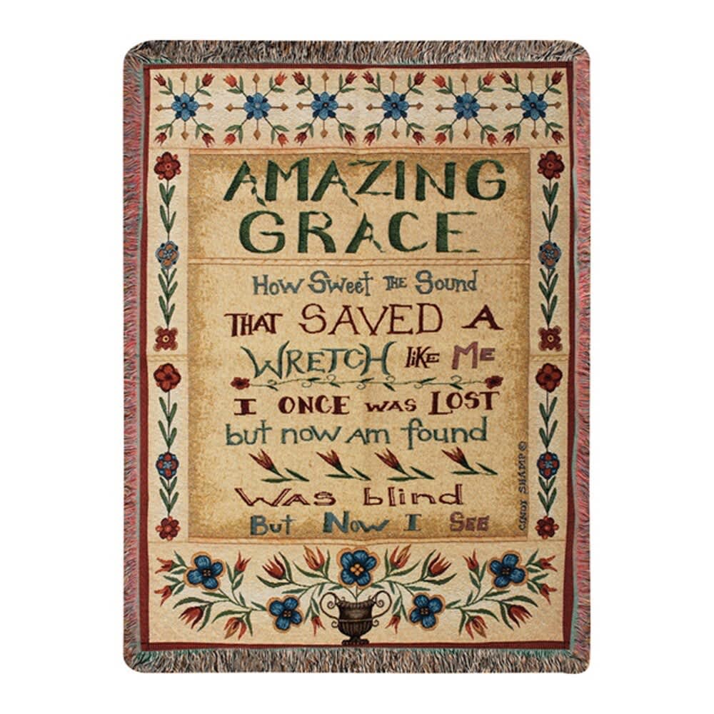 Decorative woven wall hanging with floral border and the words "Amazing Grace"
