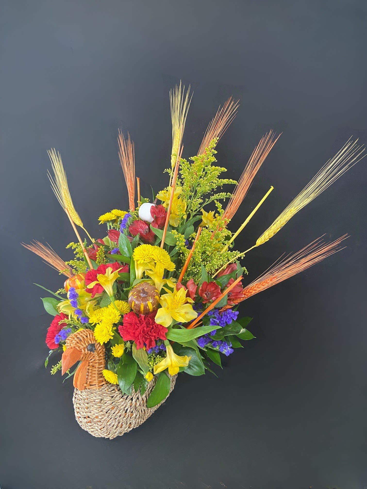 Gobble, Gobble! - You can't have Thanksgiving without Turkey! This adorable wicker turkey is absolutely STUFFED with beautiful fall flowers. A perfect centerpiece for any holiday gathering! These good looking gobblers sold out last year so get them before they are gone!