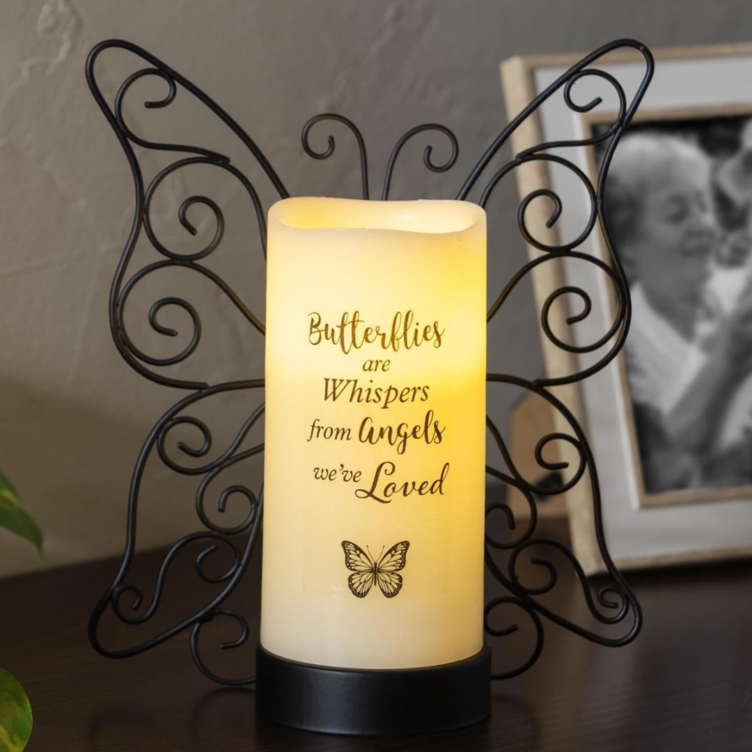 Butterfly memorial candle in a black metal holder