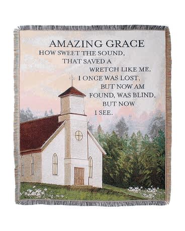 Fringed throw blanket with a church scene and "Amazing Grace" text