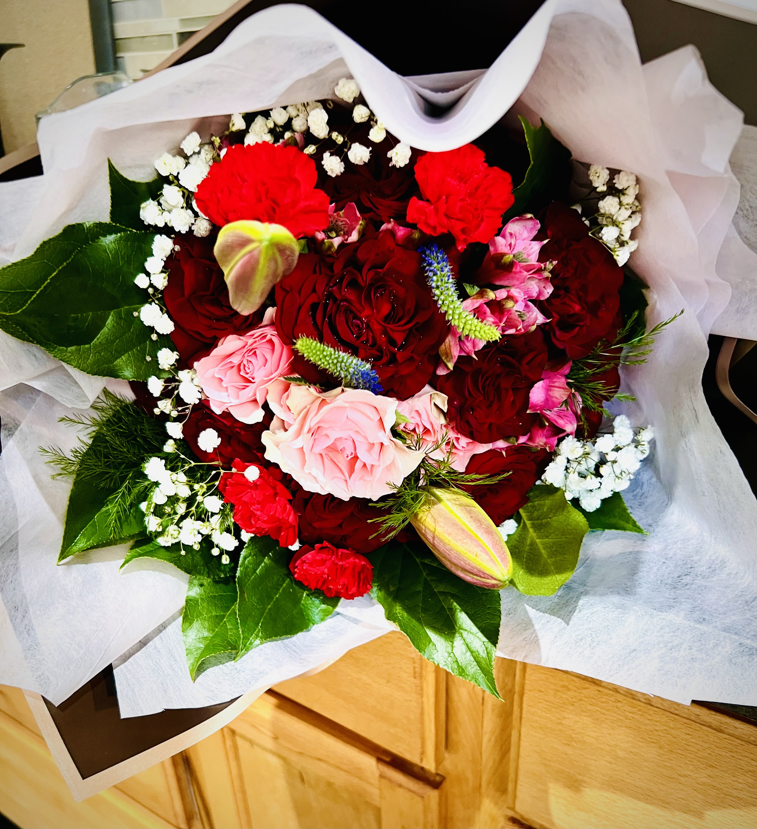 Fresh Flower Bouquet - Share your feelings by sending this  bouquet of flowers to someone special! This magical assortment of red  and pink flowers makes this bouquet a perfect gift for someone you love. This arrangement does not come in a vase.This arrangement contains premium red roses, carnations and fresh seasonal greens .For same day delivery and Free Delivery Options Text or Call  832-973-1376.