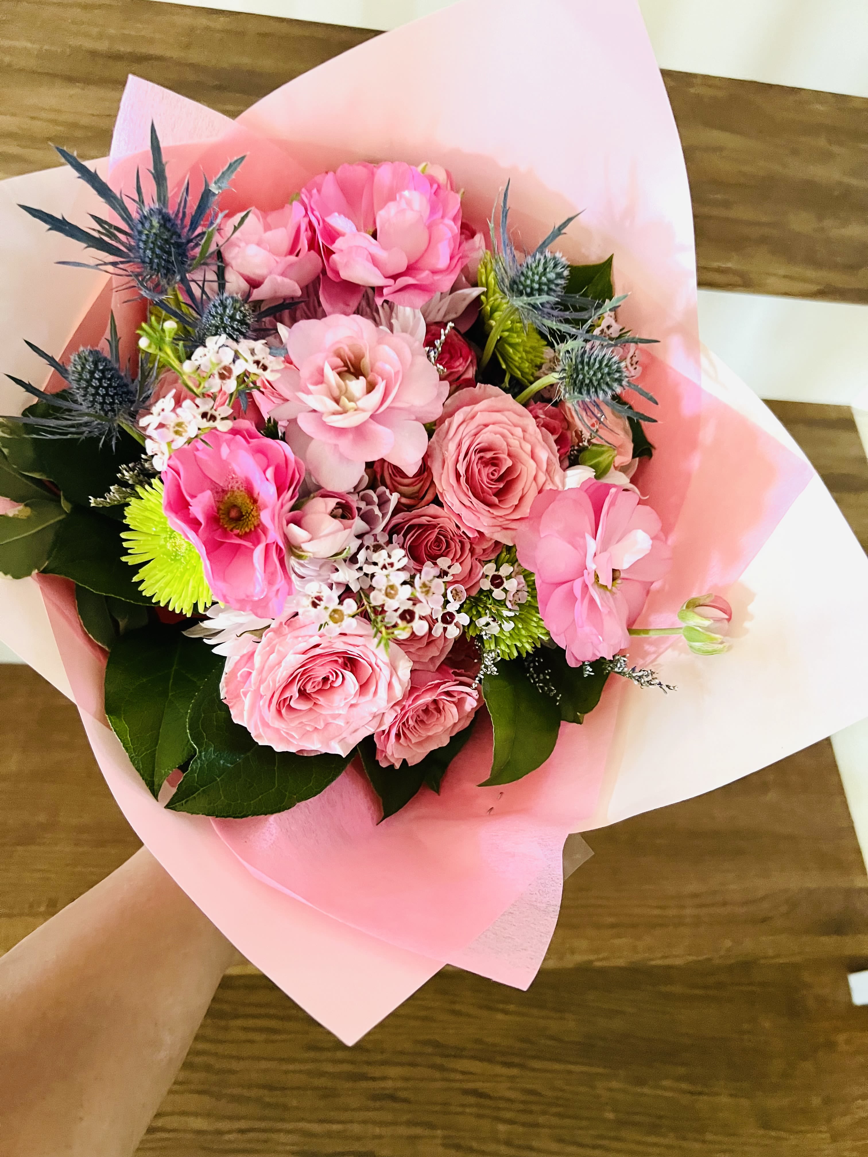 Everyday Elegance - A designer’s choice wrapped bouquet featuring 8 radiant roses paired with premium seasonal accents and lush foliage, finished with a charming bow. Thoughtfully crafted to bring a touch of joy and sophistication to everyday moments. Perfect as a cheerful pick-me-up or a simple gesture of appreciation. Each bouquet is uniquely styled with the freshest blooms of the season.  For same day delivery and Free Delivery Options Text or Call  832-973-1376.