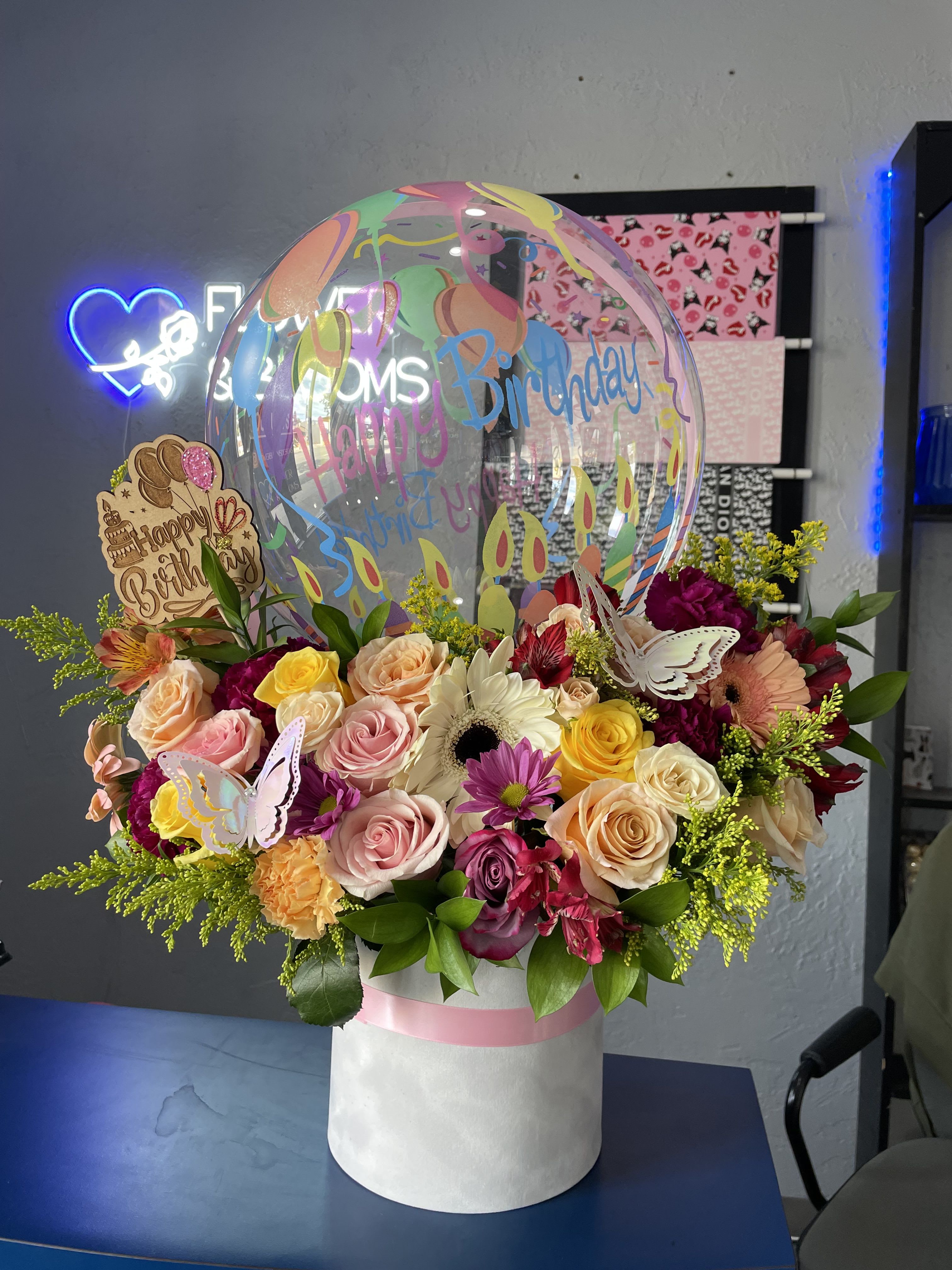 Mixed bouquet in a white hatbox with a birthday balloon