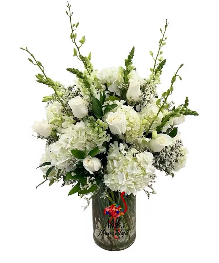 Elegant White - Elegant mixed premium white floral in a large cylinder vase.