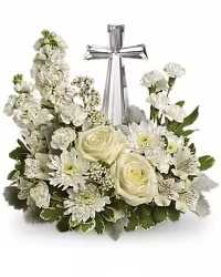Pure Faith Crystal Cross Arrangement - A serene and elegant keepsake floral arrangement featuring a crystal cross centerpiece, surrounded by all-white blooms, including lilies, roses, and other seasonal white flowers, accented with fresh greenery.  This timeless design symbolizes purity, peace, and remembrance, making it a meaningful tribute for sympathy, memorials, or honoring a cherished life. The crystal cross serves as a lasting keepsake to remember and celebrate a loved one.