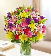 Florist Choice Multicolor Sympathy Arrangement - A thoughtful florist-choice sympathy arrangement featuring a beautiful selection of fresh seasonal flowers in a variety of colors, carefully chosen by our florists for quality and design. Accented with fresh greenery, this arrangement creates a balanced and uplifting display to honor a loved one.  Each design is uniquely crafted using the freshest flowers available, offering a heartfelt expression of comfort, remembrance, and sympathy during a difficult time.